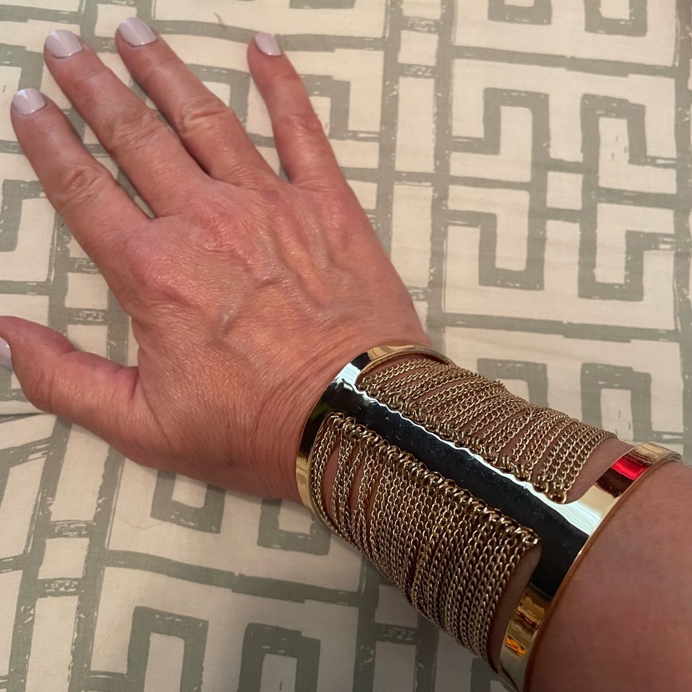 BCBG gold tone cuff bracelet with chains